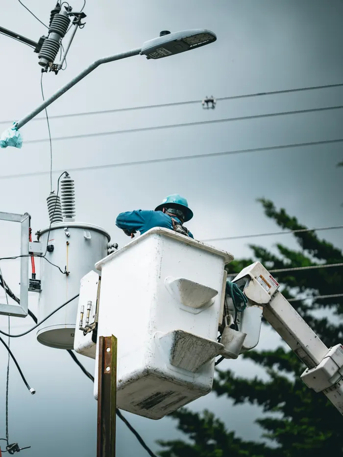Linemen working on a utility pole